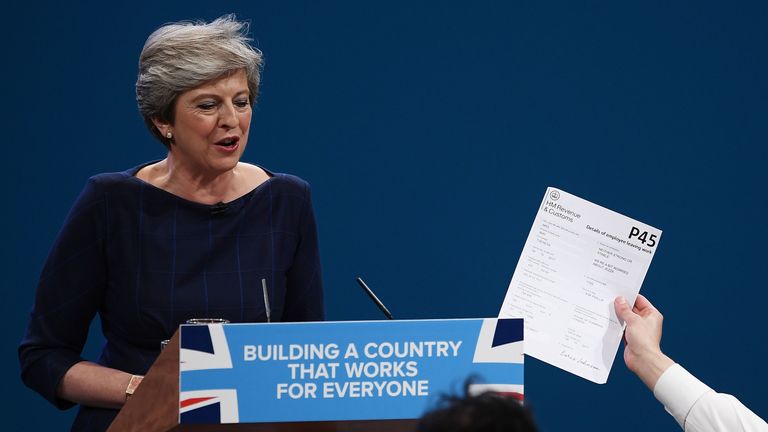 Theresa May's conference speech is interrupted by a prankster who handed her a P45