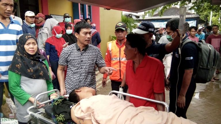 A survivor receives medical treatment at a hospital in Carita