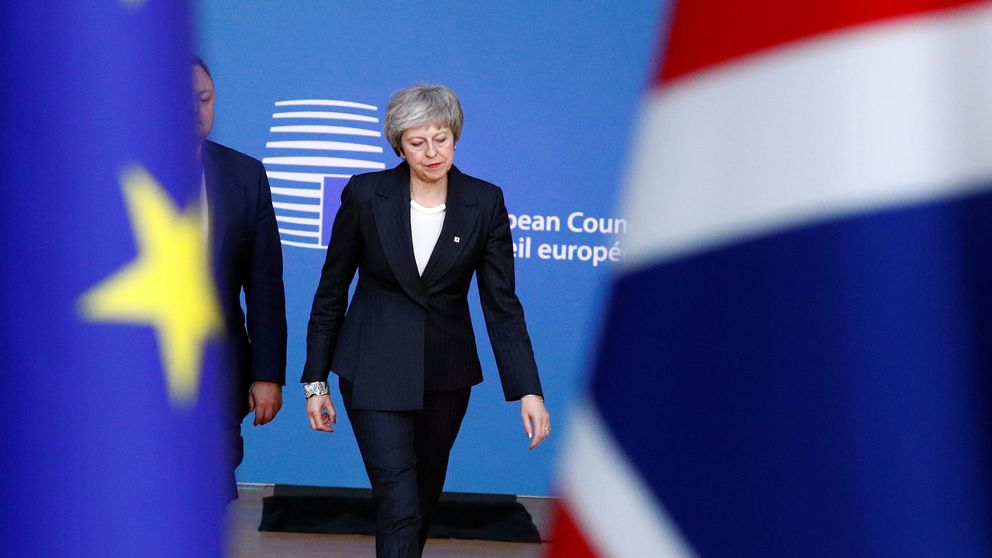 Theresa May arrives at a European Union leaders summit in Brussels