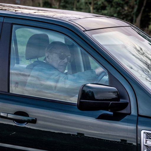 Police speak to Prince Philip - pictured driving without seatbelt