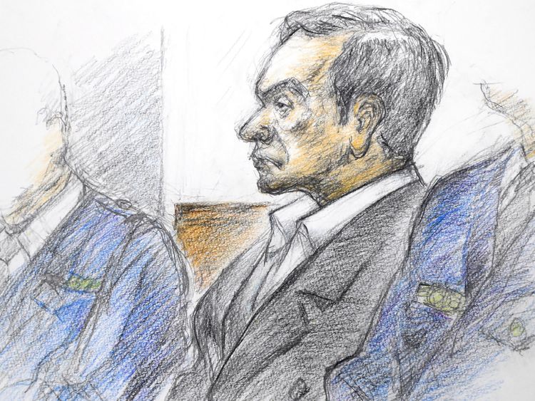 This courtroom sketch illustrated by Masato Yamashita depicts former Nissan chairman Carlos Ghosn attending his hearing at the Tokyo district court on January 8, 2019. 