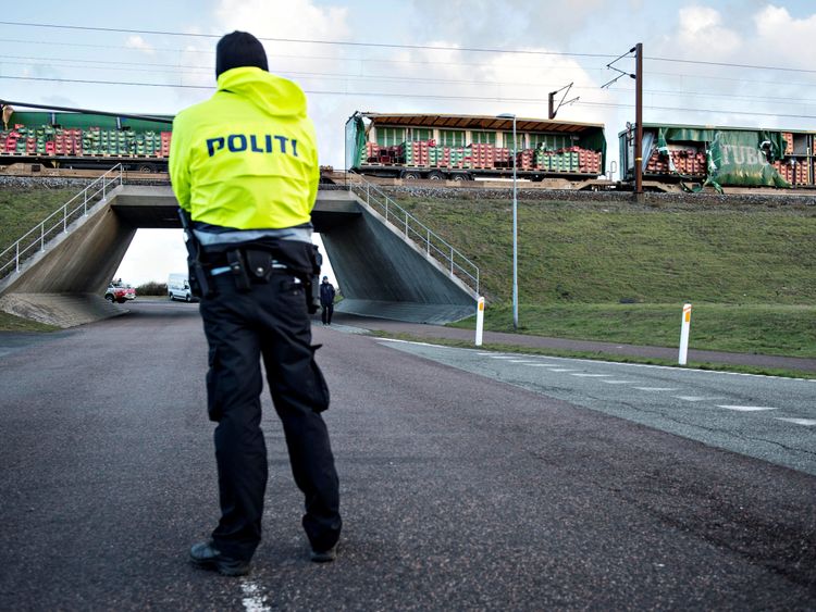 Police keep guard after a train accident on the Great Belt Bridge in Denmark