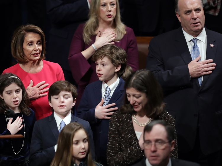 Speaker-designate Rep. Nancy Pelosi (D-CA) (L) takes the oath during the first session of the 116th Congress