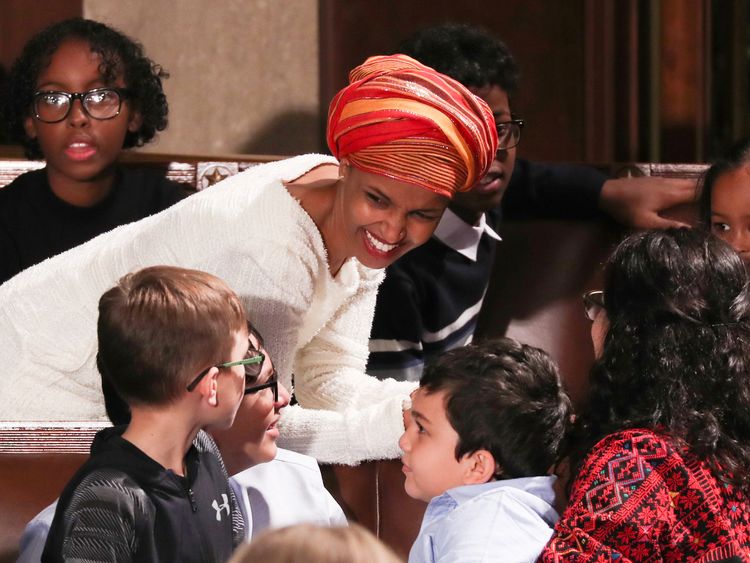 U.S. Representative-elect Ilhan Omar (D-MI) chats to children in the House Chamber