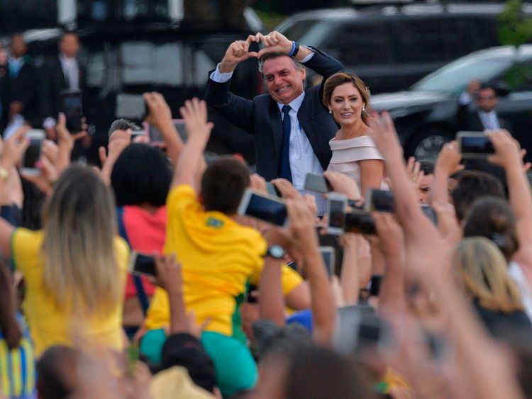 The president saluted his supporters on his way to his inauguration