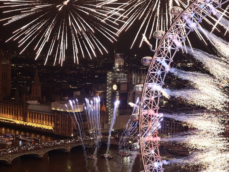 Fireworks explode over The London Eye and Elizabeth Tower near Parliament as thousands of revelers gather along the banks of the River Thames to ring in the New Year on January 1, 2019 in London, England. Parliament confirmed that after being silenced for renovation work since 2017, Big Ben's famous bongs would ring out at midnight again to welcome in 2019