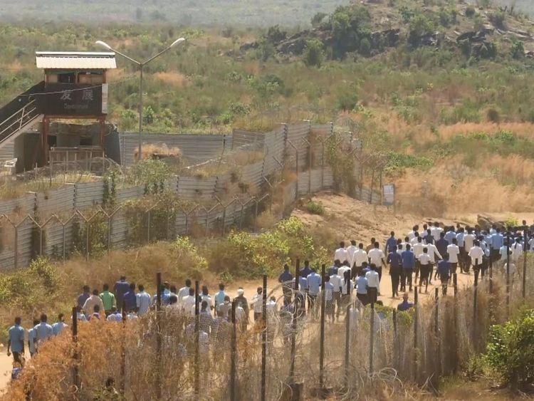 Some of the students coming back to camp under armed guard after exams