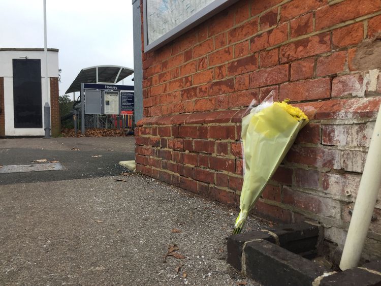 Flowers left at Horsley station near Guildford, Surrey