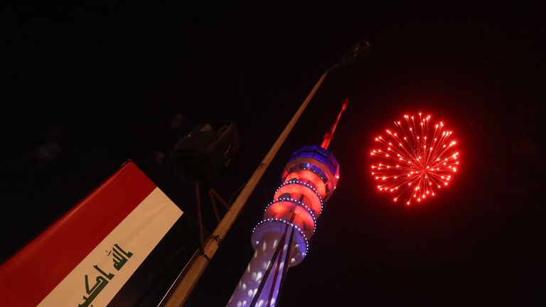 Fireworks burst above the Baghdad Tower in the Iraqi capital