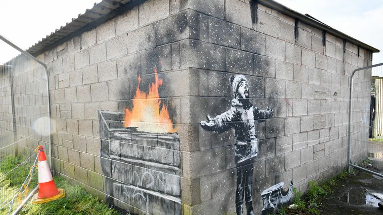 Artwork by street artist Banksy, which has appeared on a garage wall in Port Talbot