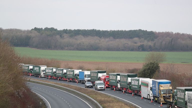 Lorries form up on the A526 outside Dover for the second of two trials at the former Manston Airport site in Kent
