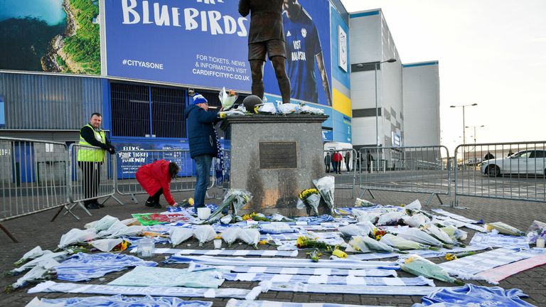 Flowers and scarves have been left outside Cardiff City's stadium