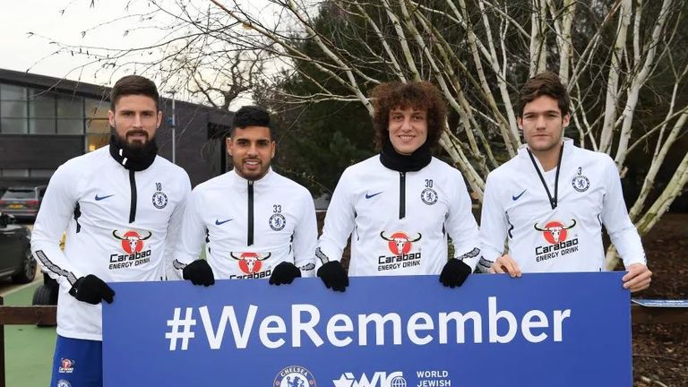 Chelsea players holding up a #WeRemember slogan. Pic: Chelsea.com