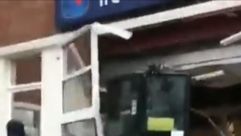 Digger smashes away at a Travelodge in Liverpool