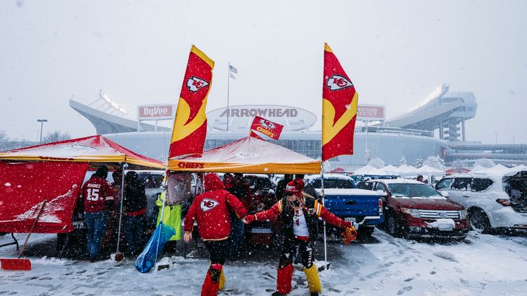 Kansas City Chiefs fans dance in a snow-filled parking lot while tailgating prior to the AFC Divisional Round playoff game between the Kansas City Chiefs and the Indianapolis Colts at Arrowhead Stadium on January 12, 2019 in Kansas City, Missouri
