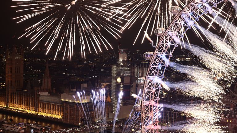 Fireworks explode over The London Eye and Elizabeth Tower near Parliament as thousands of revelers gather along the banks of the River Thames to ring in the New Year on January 1, 2019 in London, England. Parliament confirmed that after being silenced for renovation work since 2017, Big Ben&#39;s famous bongs would ring out at midnight again to welcome in 2019