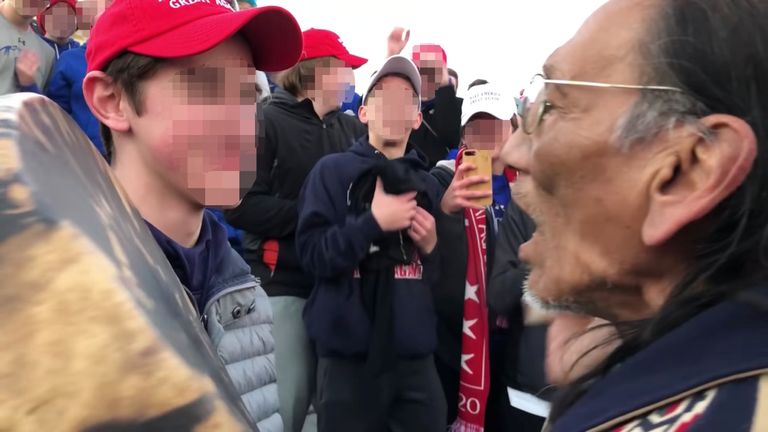 The student faced up to Nathan Phillips as fellow Covington pupils cheered him on