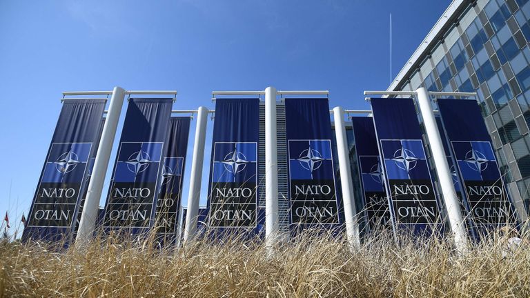 Banners with the NATO logo are pictured in front of the new NATO headquarters during a press tour of the facilities as the organization is moving from its old headquarters to the new building in Brussels on April 19, 2018. (Photo by Emmanuel DUNAND / AFP) (Photo credit should read EMMANUEL DUNAND/AFP/Getty Images) 