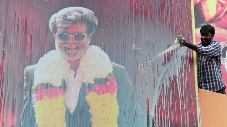 The ritual is often performed by film fans, such as here for a film starring Rajinikanth in 2016