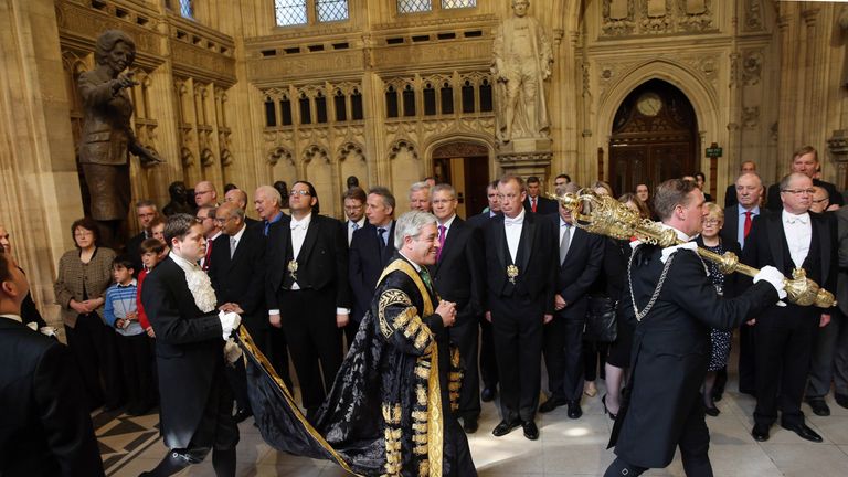 John Bercow (C), the Speaker of the House of Commons, walks through the Members&#39; Lobby before listening to the Queen&#39;s Speech at the State Opening of Parliament on May 8, 2013 in London, England