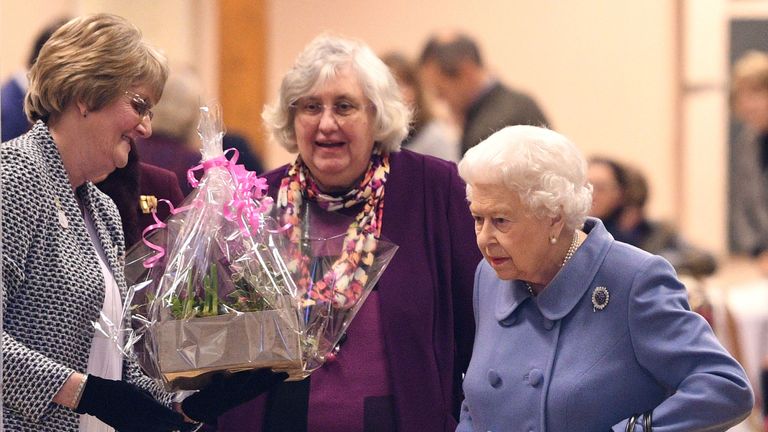 The Queen was presented with flowers when she left