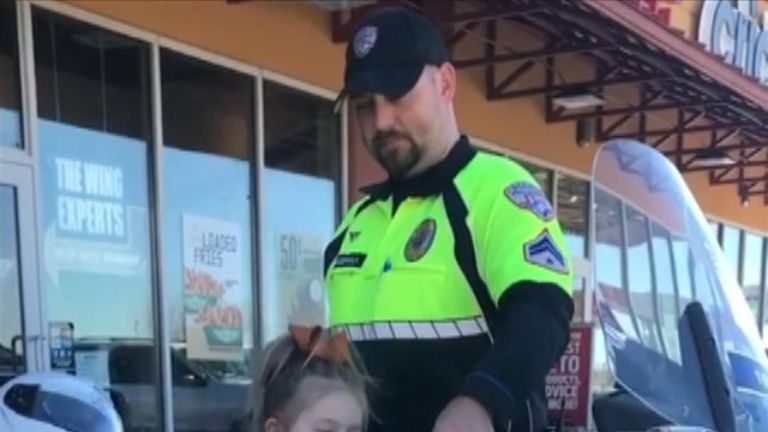 Texas cop allows curious little girl to try motorbike