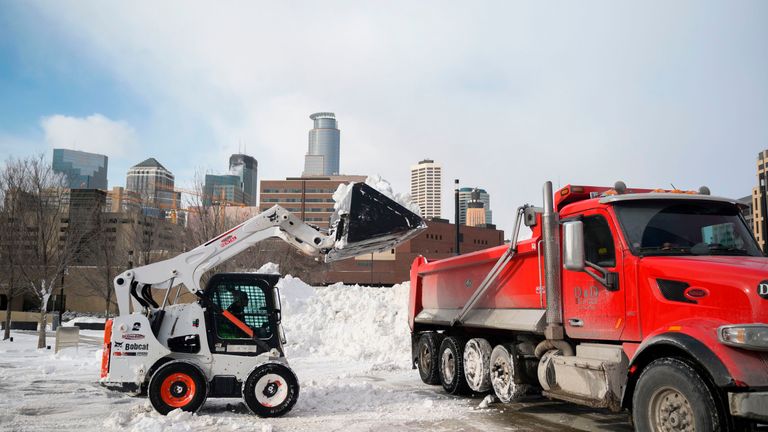 Snow is cleared in Minneapolis, where temperatures could drop as low as -70C (-94F)