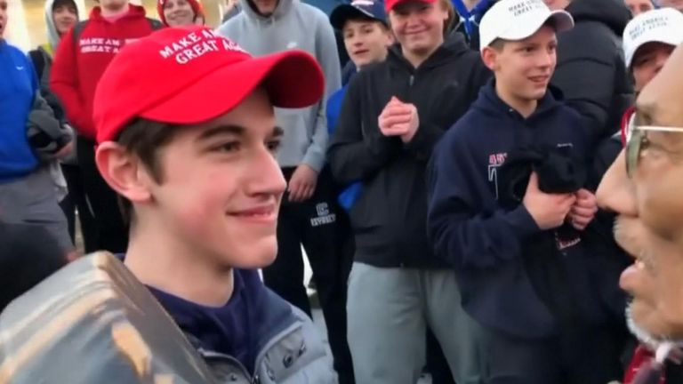 Nick Sandmann (L) denies provoking Nathan Phillips