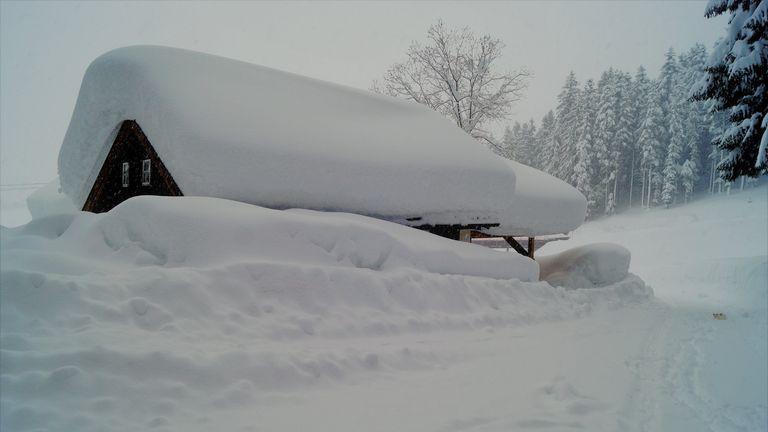 A snow-covered house in Abtenau in Austria