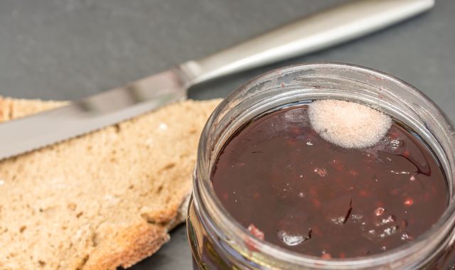 Theresa May 'scrapes mould off jam and eats preserve below' Theresa May 'scrapes mould off jam and eats preserve below'