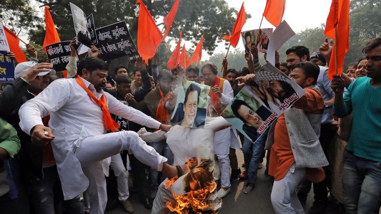 Protesters in Delhi burn an effigy depicting Paksitan&#39;s Prime Minister Imran Khan