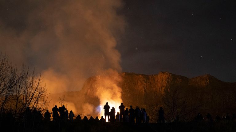 People watch on after a sizeable fire broke out on Arthur&#39;s Seat, Edinburgh