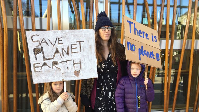 Marla Gavin-Daunt, 6, (left) and Elsie Gavin-Daunt, 8, with mum Sophie (centre) at a climate change protest outside the Scottish Parliament in Edinburgh