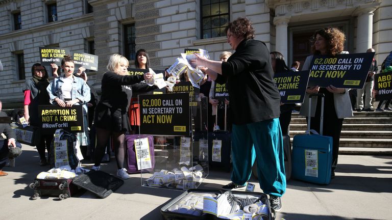 The protesters opened their suitcases outside the Northern Ireland Office