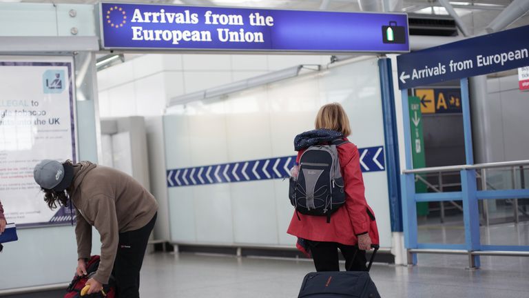 Travellers arriving from the European Union at London Stansted Airport, in Essex