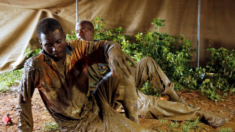 Surviving miners were exhausted and muddied after being pulled out