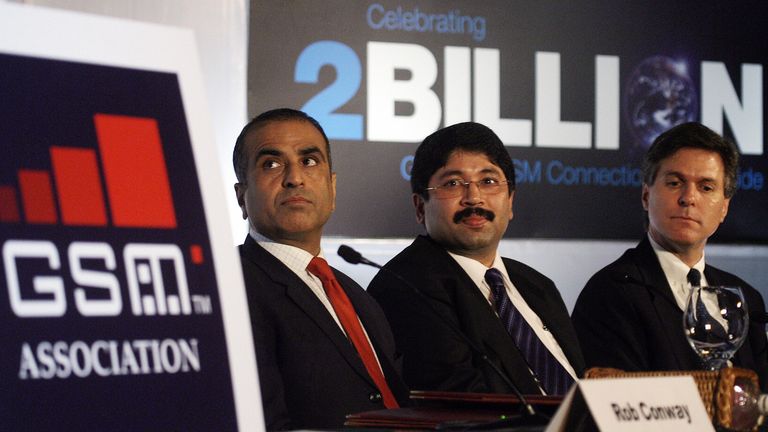 New Delhi, INDIA: Chairman GSM Association (GSMA) Craig Ehrlich, (R), Indian Minister for Communication and Information Technology, Dayanidhi Maran (C) and Chairman and Group Managing Director Bharti Enterprises and Board Member GSMA, Sunil Bharti Mittal (L) listen to a speaker during a press conference in New Delhi, 13 June 2006. The GSM technology based mobile subscriber base has touched two billion in June making it the fastest growth of technology ever witnessed in the world. AFP PHOTO/Praka
