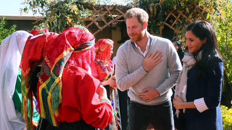 The couple greeted the girls traditionally by placing their hands over their hearts