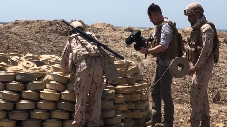 Coalition troops inspect recovered landmines