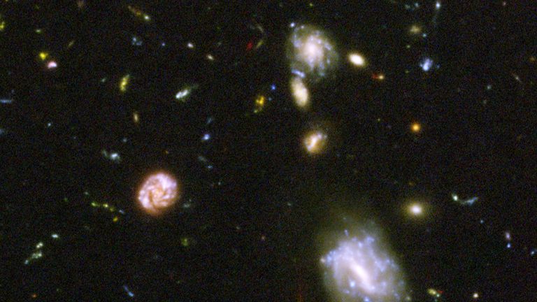 IN SPACE: In this NASA handout, a view of deepest view of the visible universe ever achieved are seen in a Hubble Telescope composite photograph released March 9, 2004. The Hubble Ultra Deep Field (HUDF) photograph is a composite of a million one-second exposures and reveals galaxies from the time shortly after the big bang. (Photo by NASA/Getty Images)
