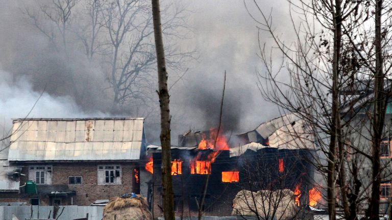 Residents reported troops destroying one house with explosives during the stand-off