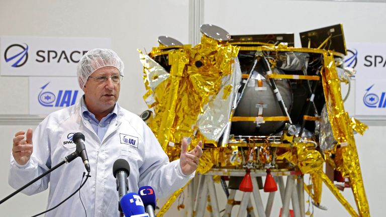 Israeli Aerospace Industries director of Space division Opher Doron speaks in front a a spacecraft weighing some 585 kilogrammes (1,300 pounds) during a presentation by Israeli nonprofit SpaceIL and Israeli state-owned Aerospace Industries, on December 17, 2018 in Yehud, east of Tel Aviv. - Israeli scientists making final preparations to launch the country&#39;s first spacecraft to the moon added a special passenger that will accompany the journey. A time capsule of three digital discs containing th