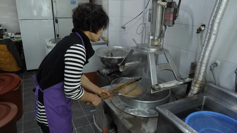 Lee Kyung-ae making noodles in her shop