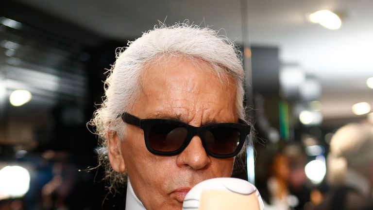 Karl Lagerfeld with his doll in Munich in 2013