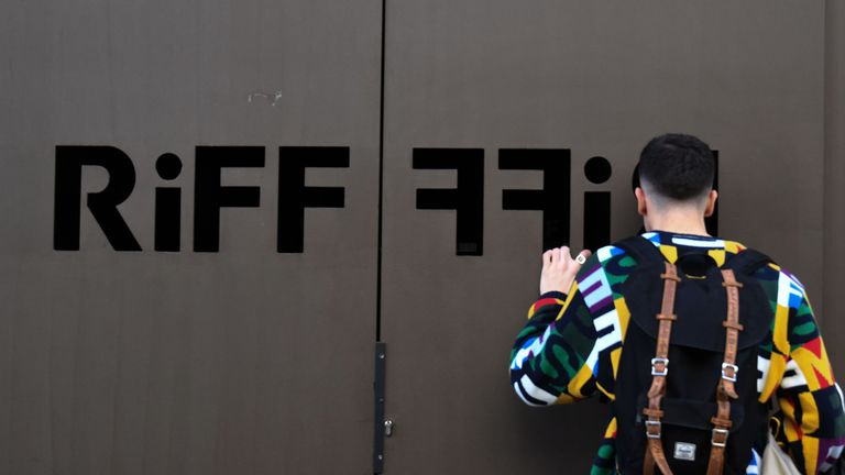 A man looks through the doors at Riff, which has been closed since Tuesday