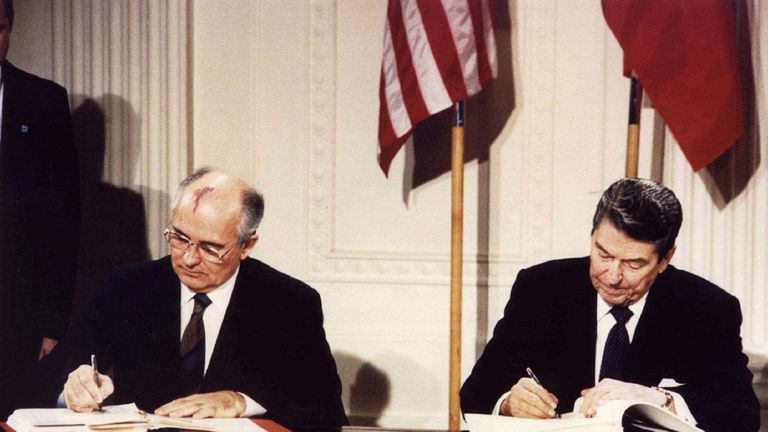 Then President Ronald Reagan (R) and Soviet President Mikhail Gorbachev sign the treaty at the White House, on 8 December 1987