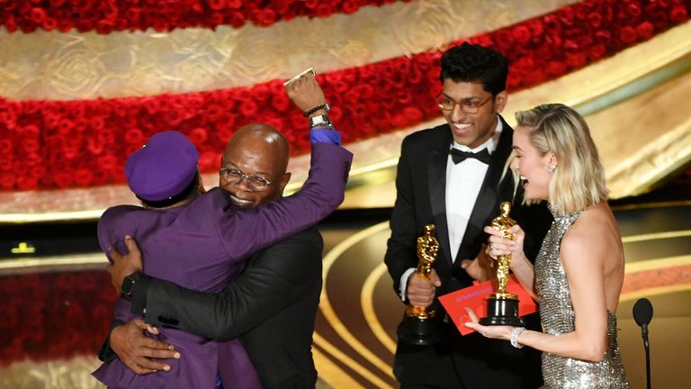 Spike Lee celebrates his award for best adapted screenplay