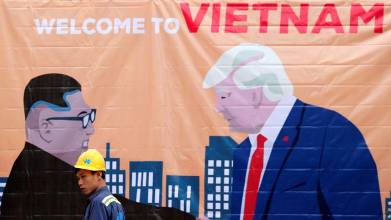 A poster welcomes Donald Trump and Kim Jong Un to Vietnam