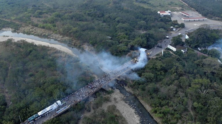 Smoke billowed from the trucks set alight on the bridge