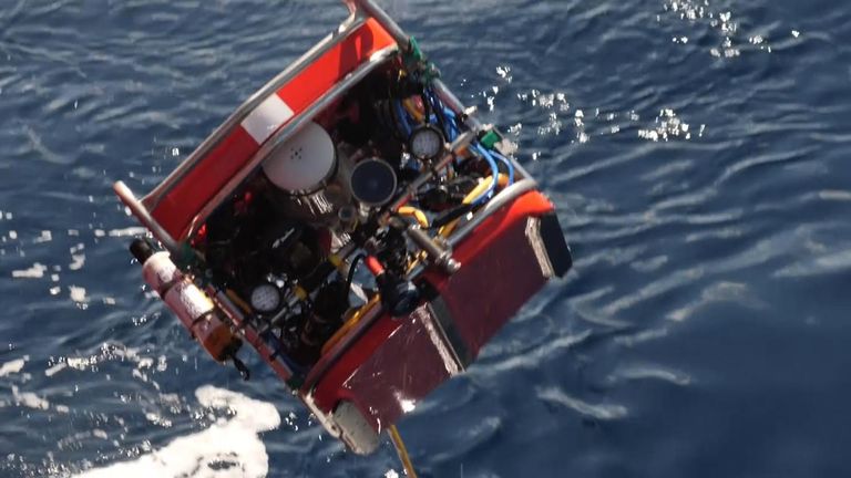 Rescuers retrieve a stricken mini-sub from the bottom of the Indian Ocean